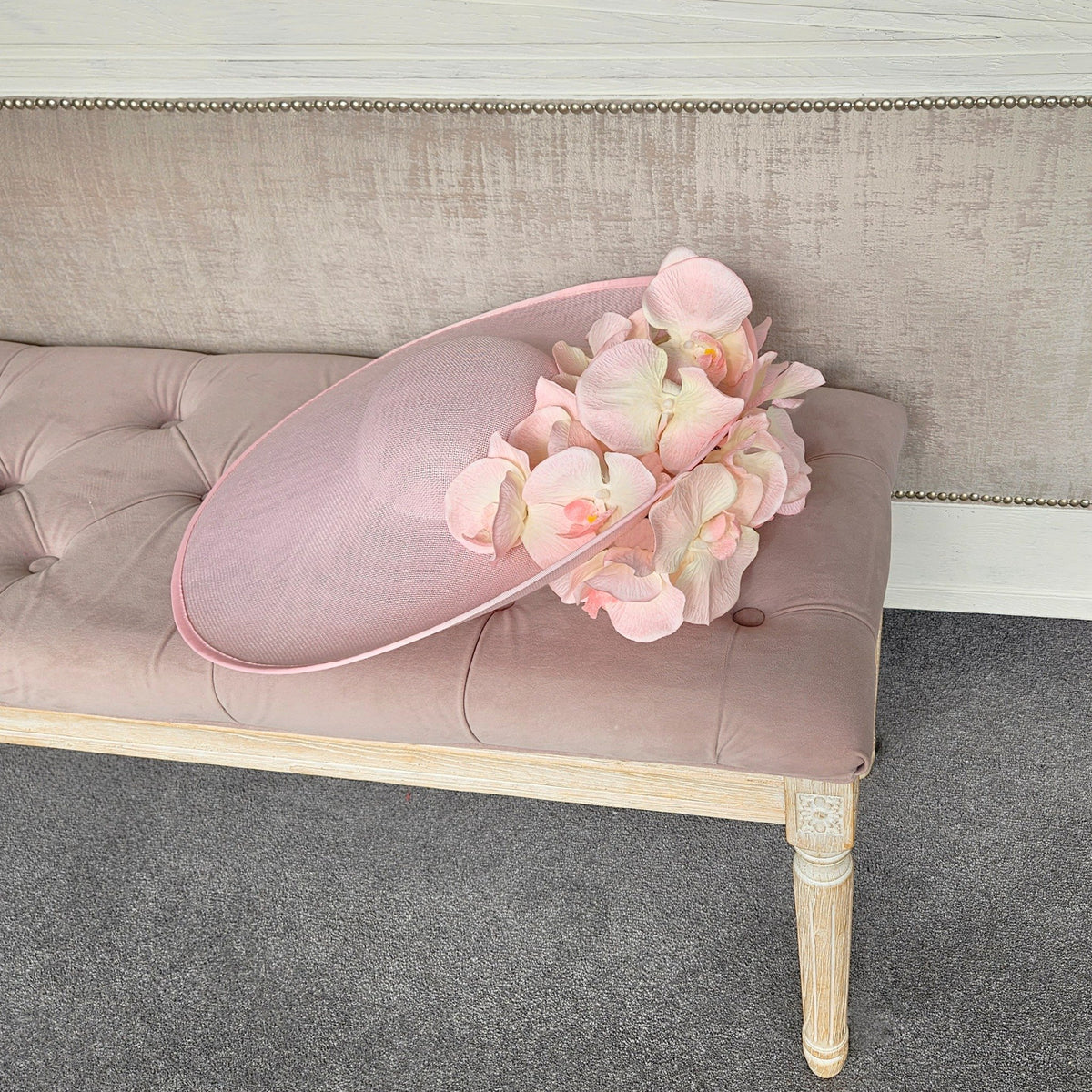 extra large pink hatinator with flowers for a ladies day at royal enclosure at Royal Ascot